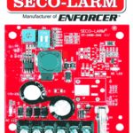SECO-LARM ST24062AQ -  Fuente de Poder con Cargador Bateria 1.5 amp 6/12/24 VCD